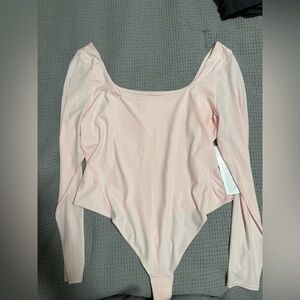 Lululemon Athletica Soft Pink Bodysuit